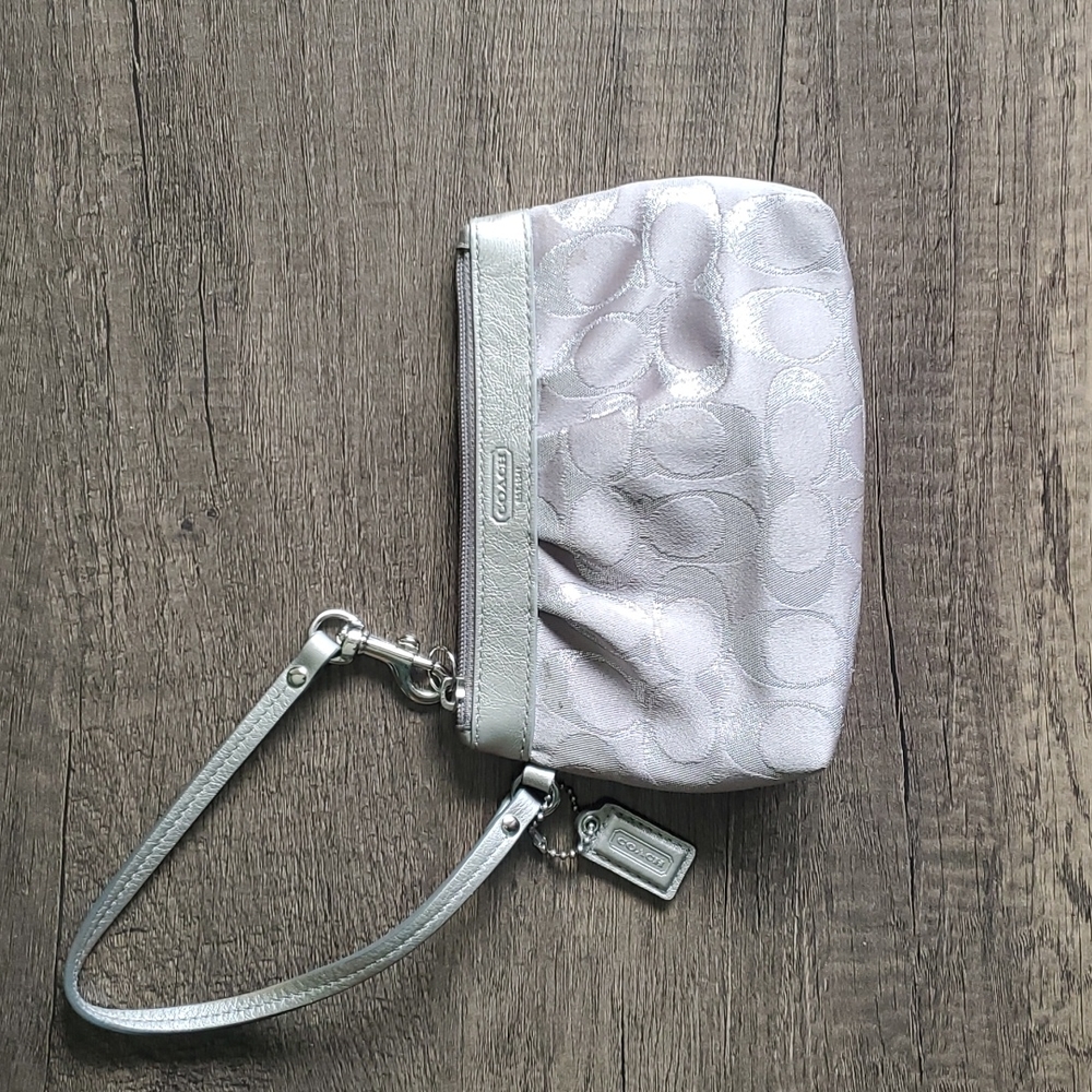 Coach | Wristlet with silver metallic leather trim and a hangtag